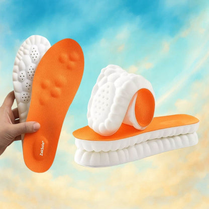 Orange and white shoe insoles held by a hand